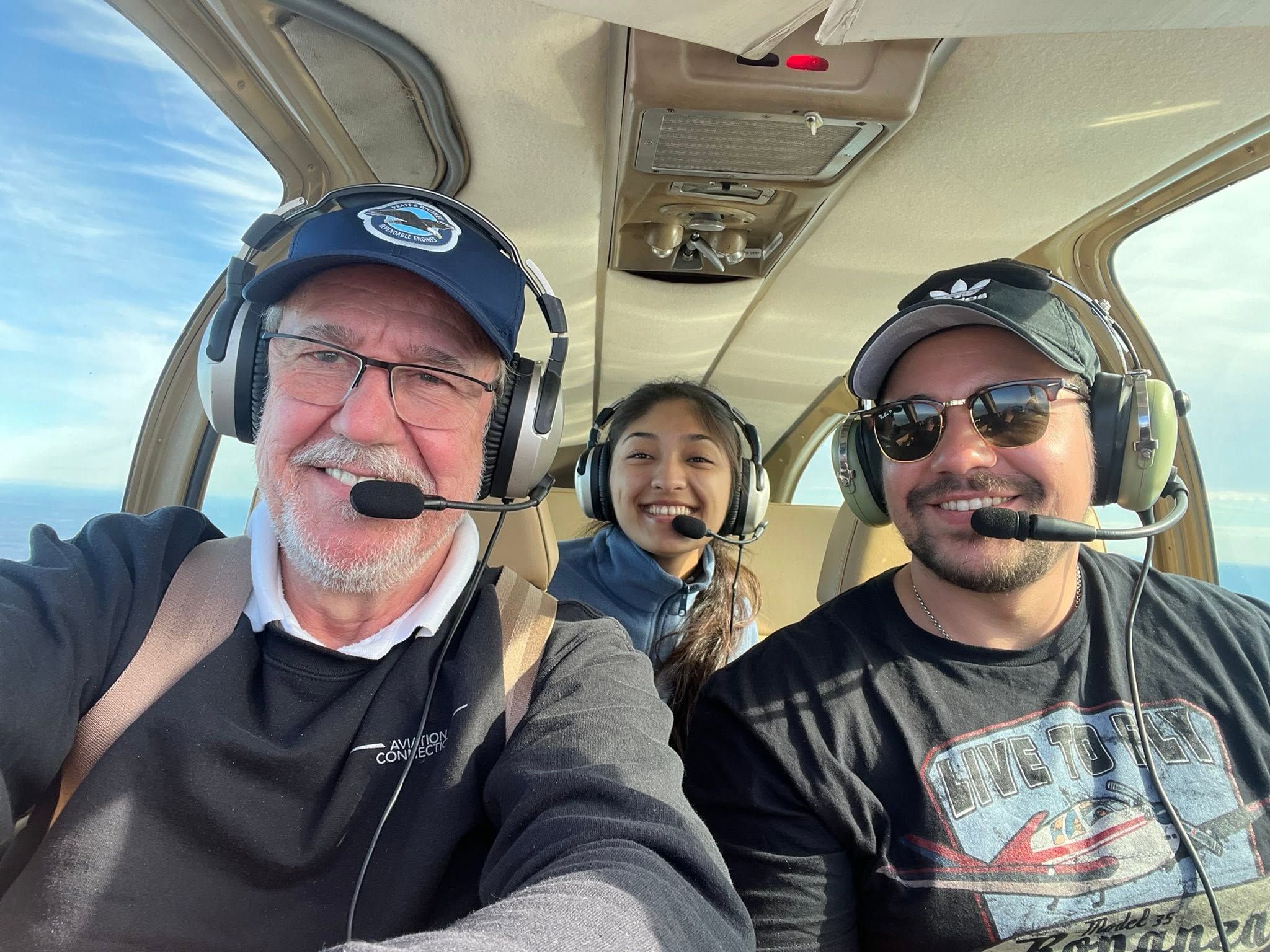The International Air Rally team in the cockpit, headsets on, ready for the route-testing trip